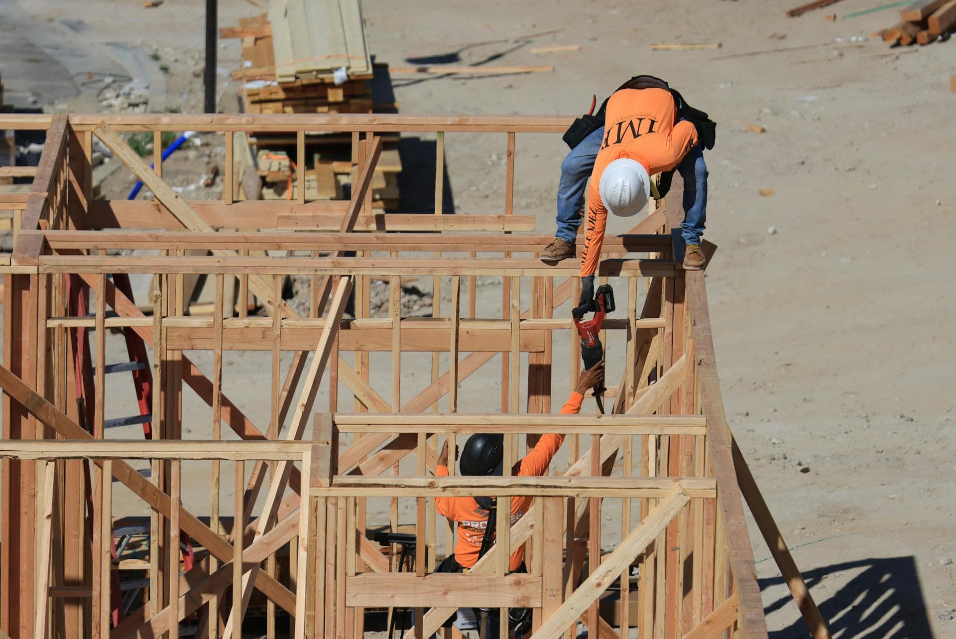 Construction workers framing a new residential structure