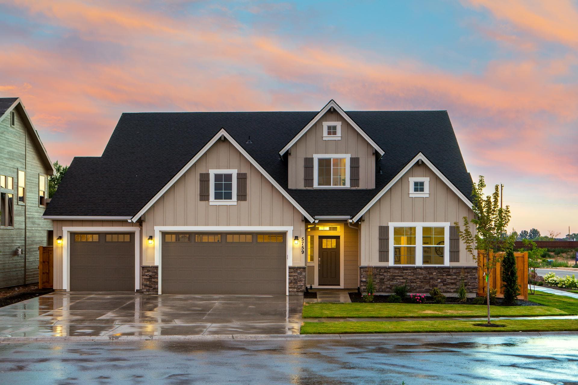 Attractive suburban home with beautiful new siding installation at sunset